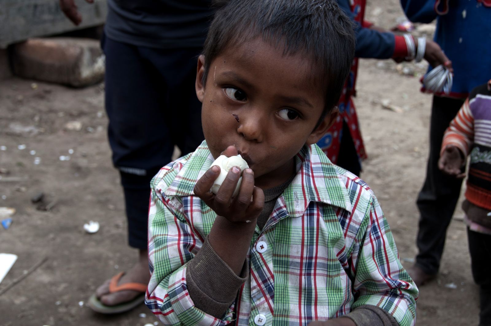 A child eating a boiled egg in a photograph from the Daily Eggs archive